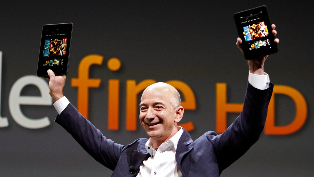 Jeff Bezos, CEO and founder of Amazon, holds the new Kindle Fire