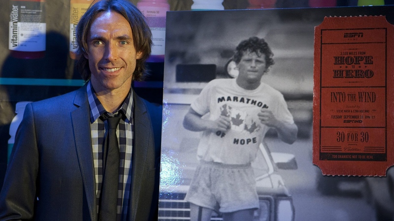 Steve Nash poses for photographers with a poster for the movie 'Into the Wind' a celebration of Terry Fox which Nash directed along with Ezra Holland in Toronto on Sunday, Sept 12, 2010. (Pawel Dwulit / THE CANADIAN PRESS)  