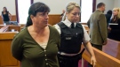 Mary Beth Harshbarger, from Meshoppen, Pa., is escorted from court in Grand Falls-Windsor, Newfoundland and Labrador as she faces a charge of criminal negligence causing death on Monday, Sept. 13, 2010.  (Andrew Vaughan / THE CANADIAN PRESS)