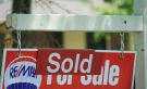 A house 'sold' sign is shown in Oakville, Ont., Monday, July 23, 2012. (Richard Buchan / THE CANADIAN PRESS)