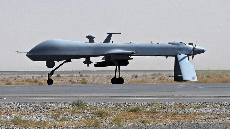 A U.S. Predator unmanned drone armed with a missile stands on the tarmac ofKandahar Airfield, Sunday, June 13, 2010. (AP / Massoud Hossaini) 