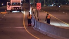 Emergency crews work on the Gardiner Expressway after a man was killed during a crash overnight, early Friday, Sept. 14, 2012.