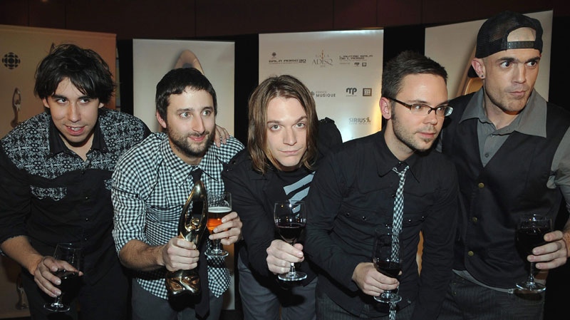 Alternative Rock group Karkwa  pose with their Felix for best group, and refreshments, at the ADISQ gala, the Quebec music industry awards ceremony in Montreal, on Sunday Nov. 2, 2008. Graham Hughes / THE CANADIAN PRESS