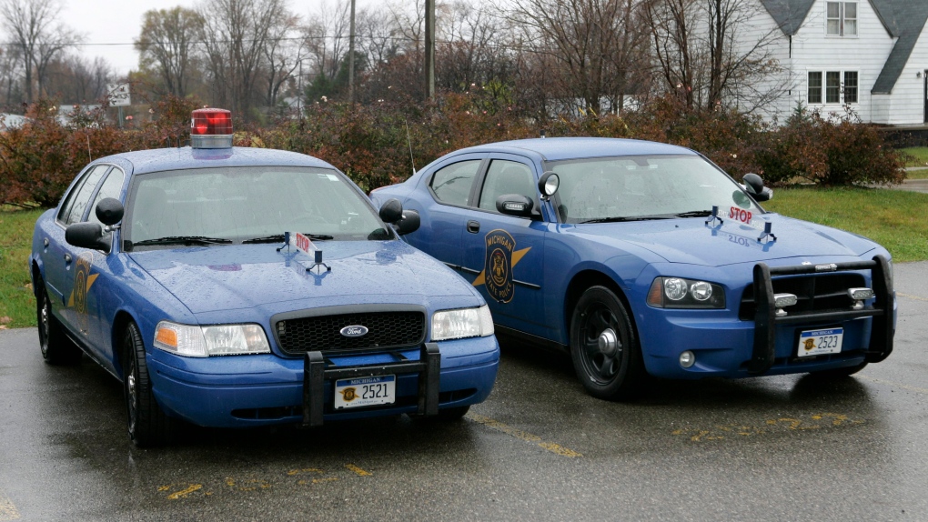 A Michigan State Police Dodge Charge, right, is shown with a Ford Crown Victoria in Taylor, Mich., W