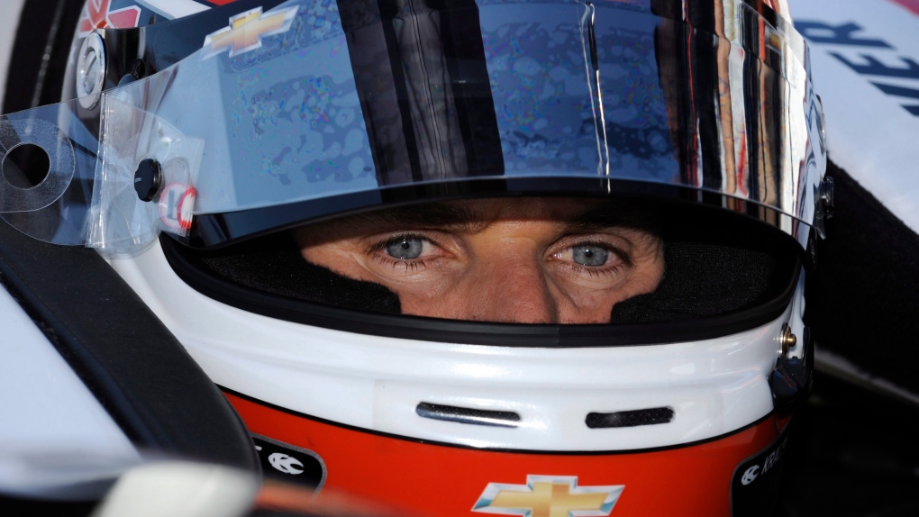Will Power, of Australia, sits in his car during practice for Saturday's IndyCar Series race at Auto