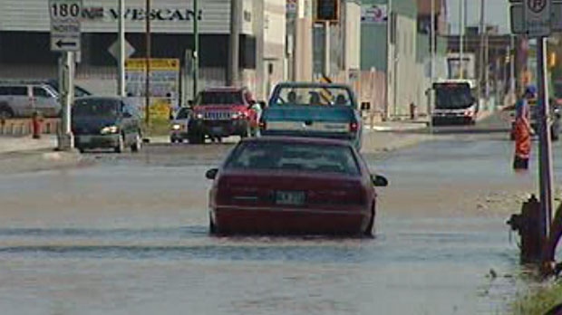 A pipe break on Logan Avenue west of McPhillips Street flooded the roadway Saturday. 