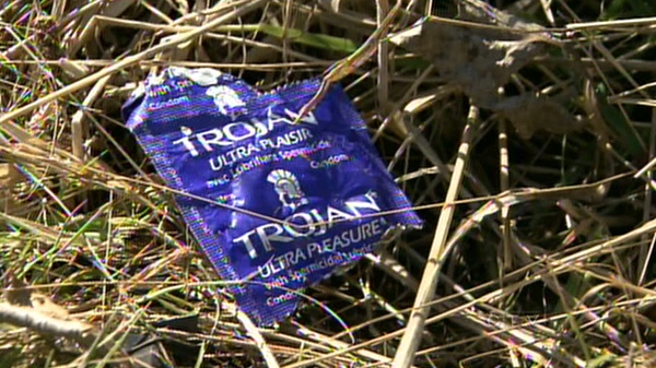 A condom wrapper lies in a field outside the Pitt Meadows, B.C. house where the party took place.