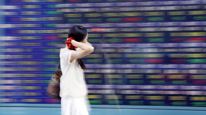 An electronic stock board of a securities firm in Tokyo on Sept. 11, 2012.