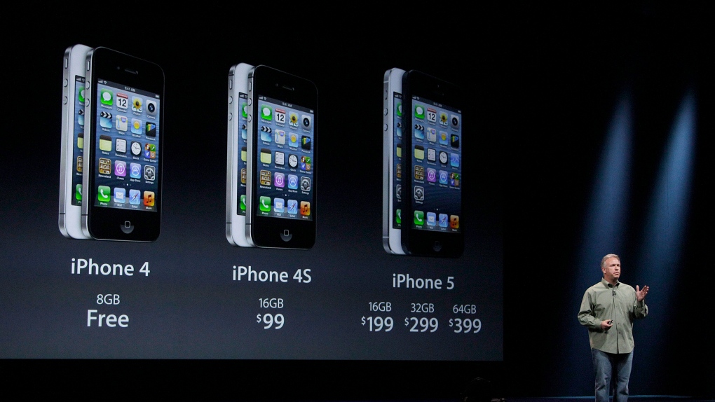 Phil Schiller, Apple's senior vice president of worldwide marketing, gives prices of the iPhone 5 du