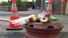 Flowers mark the site of a fatal collision at a temporary bus stop on Albert Street, Friday, Sept. 17, 2010.