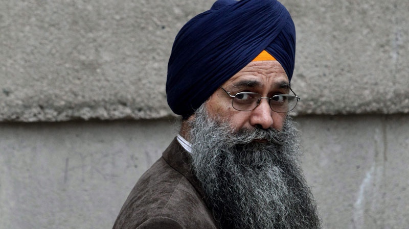 Inderjit Singh Reyat, the only man ever convicted in the Air India bombings of 1985, waits outside B.C. Supreme Court during a fire drill which forced everyone in the building outside prior to the start of the second day of his perjury trial in Vancouver, B.C., on Friday September 10, 2010. (Darryl Dyck / THE CANADIAN PRESS)