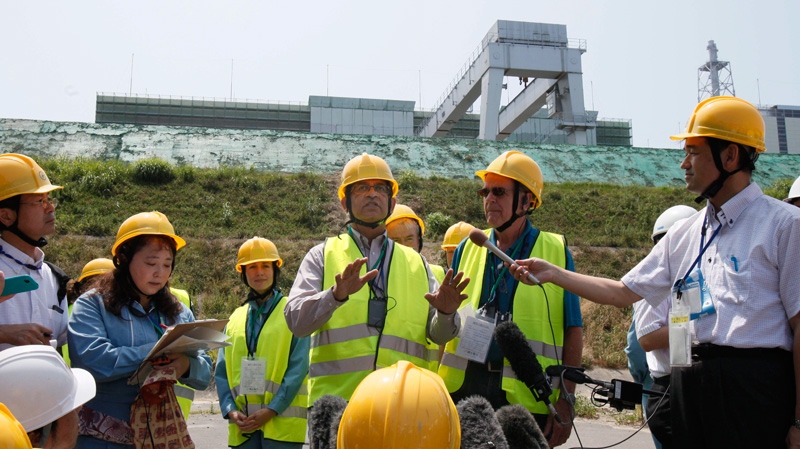 IAEA group head Sujit Samaddar, centre, speaks at the Onagawa nuclear power plant on July 31, 2012.
