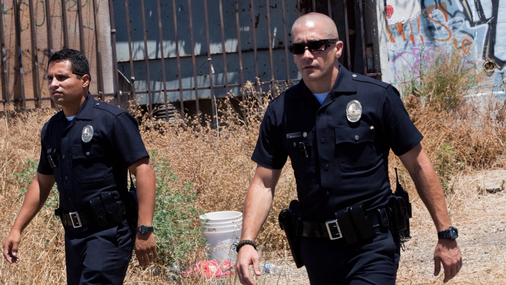 Michael Pena, left, and Jake Gyllenhaal in a scene from VVS Films' 'End of Watch.'