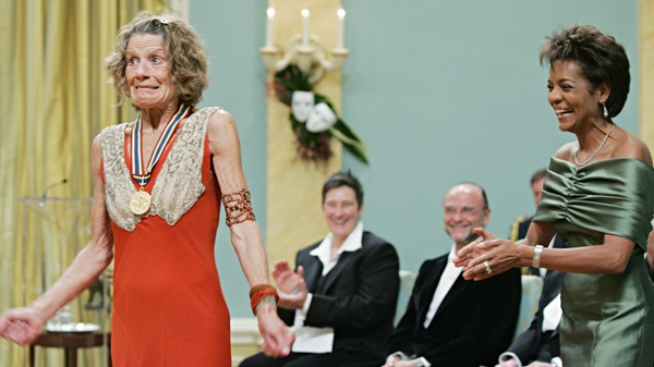 Governor General Michaelle Jean (right) laughs as Jackie Burroughs reacts to going the wrong way after receiving the lifetime achievement award for the performing arts during a ceremony at Rideau Hall in Ottawa, Friday, Nov. 4, 2005. (Jonathan Hayward / THE CANADIAN PRESS)