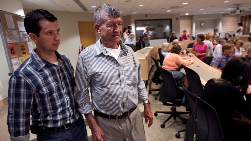 Dos Erres massacre survivor Oscar Alfredo Ramirez Castaneda, left, and his father on May 30, 2012.