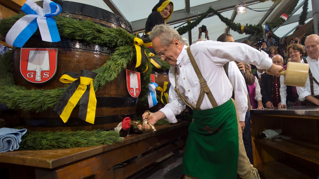 Mayor of Munich Christian Ude taps the first beer barrel