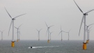 A small boat passes through the windmills of the Thanet Offshore Wind Farm off the coast of Ramsgate in Kent, England Thursday Sept. 23, 2010 as it is officially opened becoming the world's largest site of its type. (AP Photo/Gareth Fuller/PA ) 