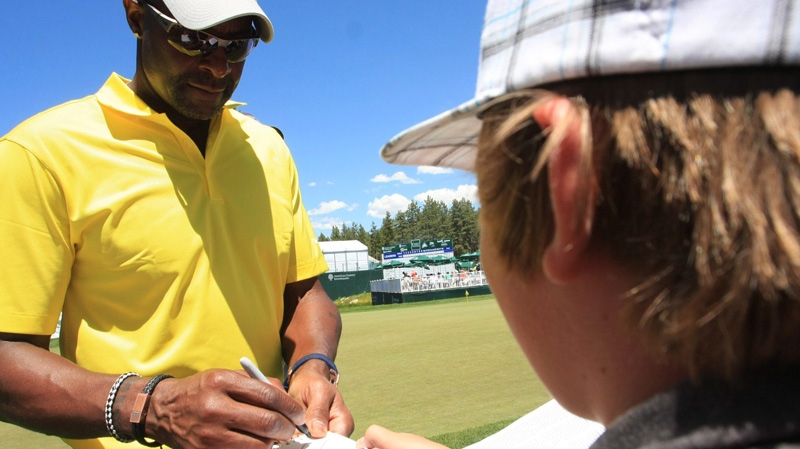 Jerry Rice signs an autograph in Stateline, Nev. on July 21, 2012.