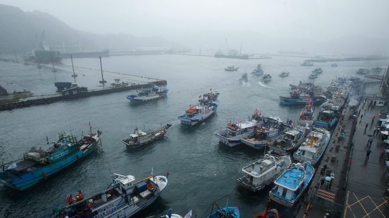 Fishing boats set out from Suao harbour, Taiwan to the East China Sea on Sept. 24, 2012.