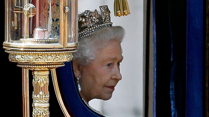 Queen Elizabeth II returns to Buckingham Palace in a carriage after attending the Houses of Parliament in London for the official State Opening of Parliament. Friday Sept. 24, 2010. (AP  / Kirsty Wigglesworth)