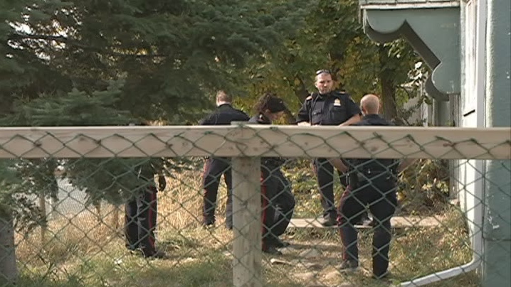 Saskatoon police investigate after an officer shot a dog at a home on 22nd Street West on Monday.
