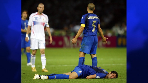 Zinedine Zidane, left, looks on after butting Marco Materazzi, prone, on July 9, 2012.