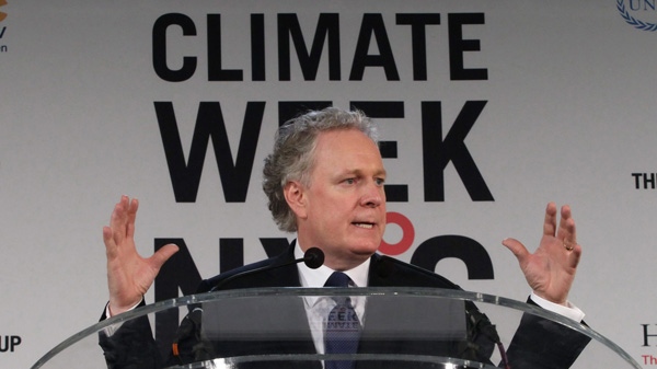 In this photo provided by The Climate Group, Jean Charest, Premier of Quebec, speaks at the opening ceremony for Climate Week NYC Monday Sept. 20, 2010 in New York. (AP Photo/The Climate Group, Tina Fineberg) 