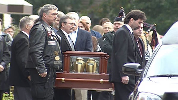 Leo Paul and Sherrie Regnier's ashes get carried out of the M. John Sullivan Funeral Home in Cornwall, Monday, Sept. 27, 2010.