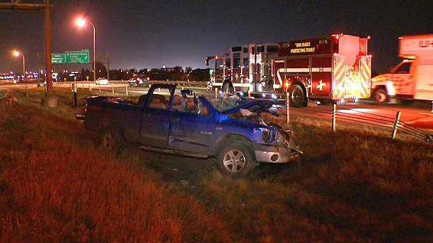 Emergency crews on the scene of a fatal single-vehicle rollover on the QE2 on Thursday, September 27.