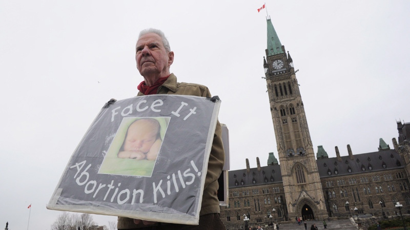 A lone anti-abortion protester on Parliament Hill in Ottawa on April 26, 2012.