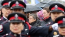 Marthe Roy (left) the mother and Marie Boucher (right) wife of Bromont, Quebec police Const. Vincent Roy who died in the line of duty on Dec. 1, 2011 watch a parade of police officers during the Canadian Police and Peace Officers annual memorial service on Parliament Hill in Ottawa, Sunday, Sept. 30, 2012. (Fred Chartrand / THE CANADIAN PRESS)