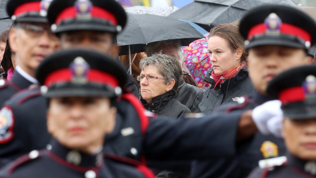 Marthe Roy (left) the mother and Marie Boucher (right) wife of Bromont, Quebec police Const. Vincent