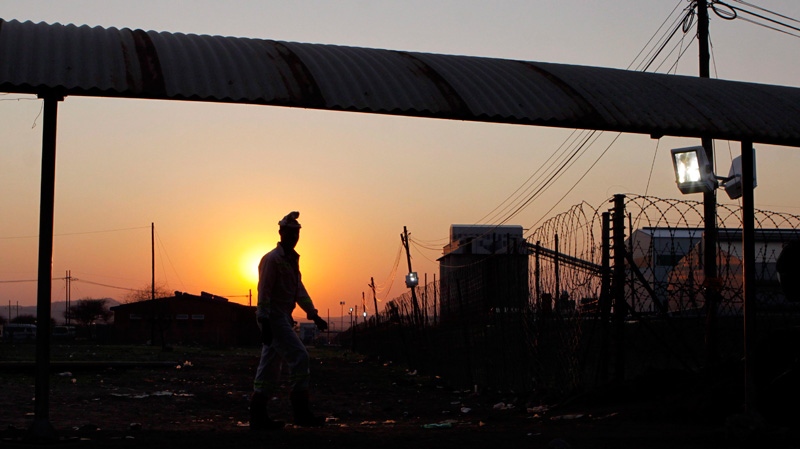 A miner returns to work at the Lonmin Platinum mine in Marikana, outh Africa on Sept. 20, 2012.