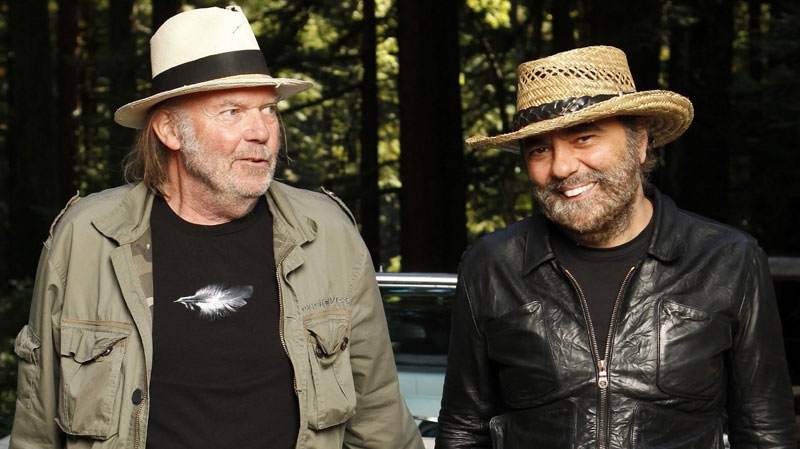 In this Sept. 10, 2010 file photo, musicians Neil Young, left, and Daniel Lanois are photographed in Woodside, Calif. (AP Photo/Jeff Chiu, file)