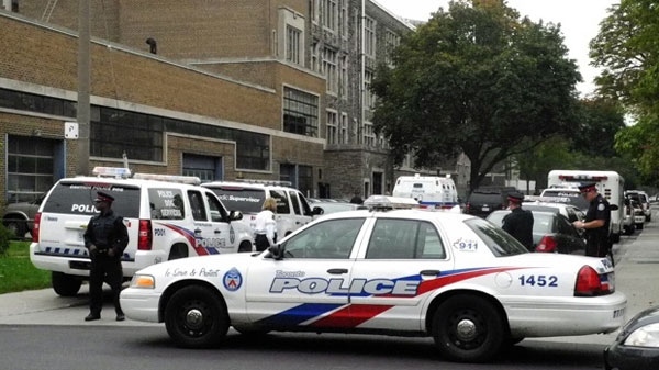 Police are seen at Central Tech high school, near Harbord and Bathurst Streets, after reports of a shooting in the school on Thursday, Sept. 30, 2010. (John Hanley / CTV News)
