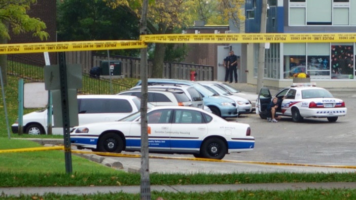 Police tape surrounds the area where an armed suspect is believed to be hiding in Toronto's east end. (Tom Podolec/CTV)