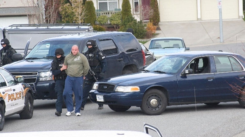  Heavily armed police arrest Jamie Bacon, who police say is a notorious gang member, outside his Abbotsford, B.C., home early morning on Friday, April 3, 2009 (special to ctvbc.ca) 