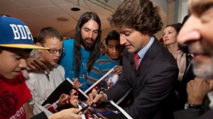Liberal leadership candidate Justin Trudeau signs photos after a event in Richmond, B.C., Wednesday, Oct. 3, 2012. (The Canadian Press/Jonathan Hayward)