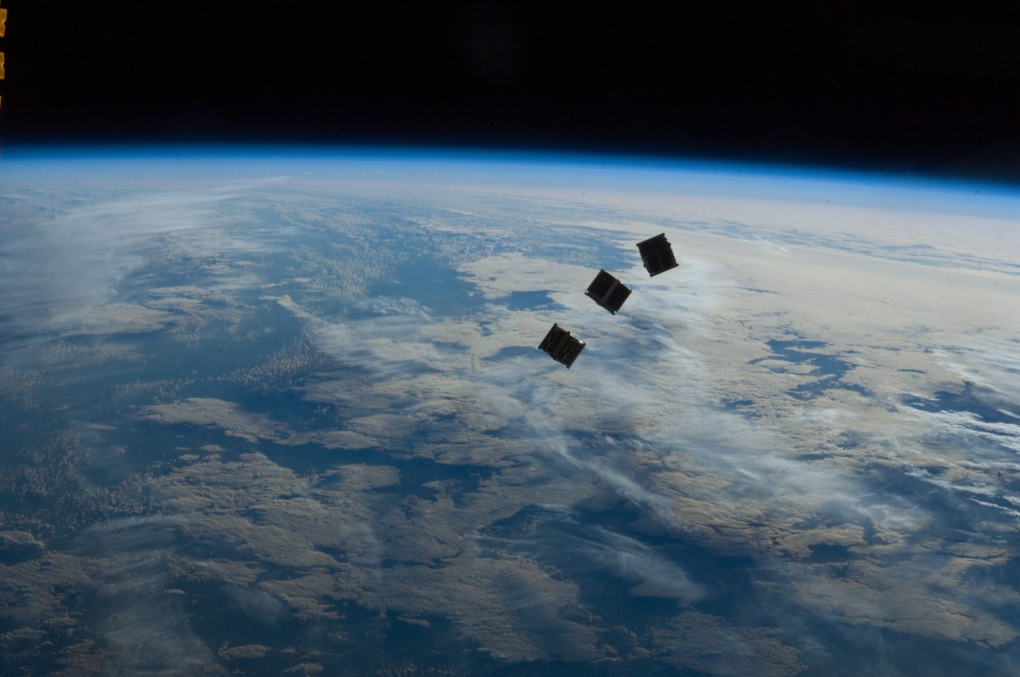 Tiny satellites as photographed by from the ISS
