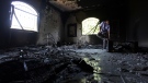 A Libyan man investigates the inside of the U.S. Consulate, after an attack that killed four Americans, including Ambassador Chris Stevens on the night of Tuesday, Sept. 11, 2012, in Benghazi, Libya,  Sept. 13, 2012. (AP / Mohammad Hannon)