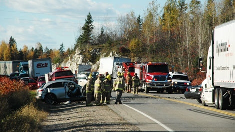 Emergency workers respond to a fatal two-vehicle collision on Highway 17, Thursday, Oct. 7, 2010.