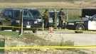 Investigators work at the scene of a murder in Arthur, Friday, Oct. 8, 2010.