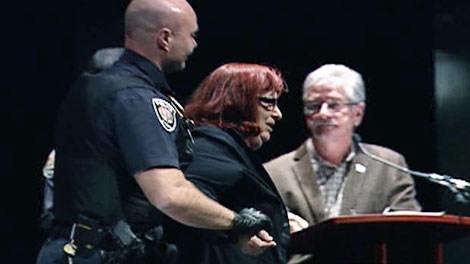 Police remove mayoral candidate Jane Scharf from a debate at the Bronson Centre, Thursday, Oct. 7, 2010.
