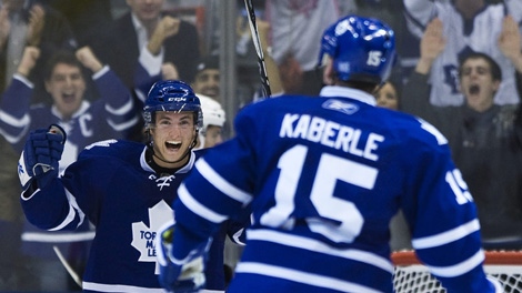 Toronto Maple Leafs forward Tyler Bozak, left, celebrates a goal with Maple Leafs defenceman Tomas Kaberle, right, while playing against the Ottawa Senators during third period NHL action in Toronto on Saturday, October 9, 2010. THE CANADIAN PRESS/Nathan Denette