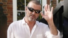 British singer George Michael outside his house in Highgate, London, after being released from prison, Monday, Oct. 11, 2010.  (AP / Yui Mok) 