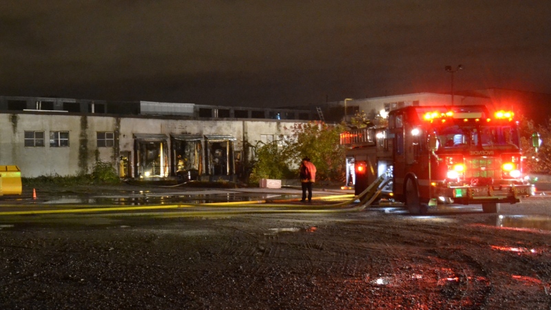 A fire truck is parked at the scene of a warehouse fire in Lachine, Quebec (Oct. 16, 2012. CTV Montreal/Cosmo Santamaria)