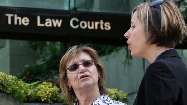 Former sex-trade worker Sheri Kiselbach, left, and lawyer Katrina Pacey speak to the media outside British Columbia Court of Appeal in Vancouver, B.C., on Thursday May 28, 2009. (Darryl Dyck / THE CANADIAN PRESS)