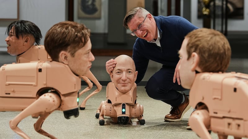Robot dogs with Musk and Zuckerberg heads roam around Berlin museum