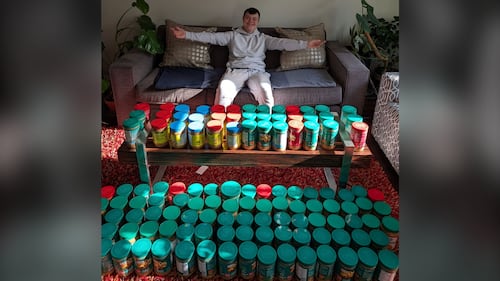 Young volunteer with Down syndrome collecting peanut butter for food-insecure children in Waterloo Region