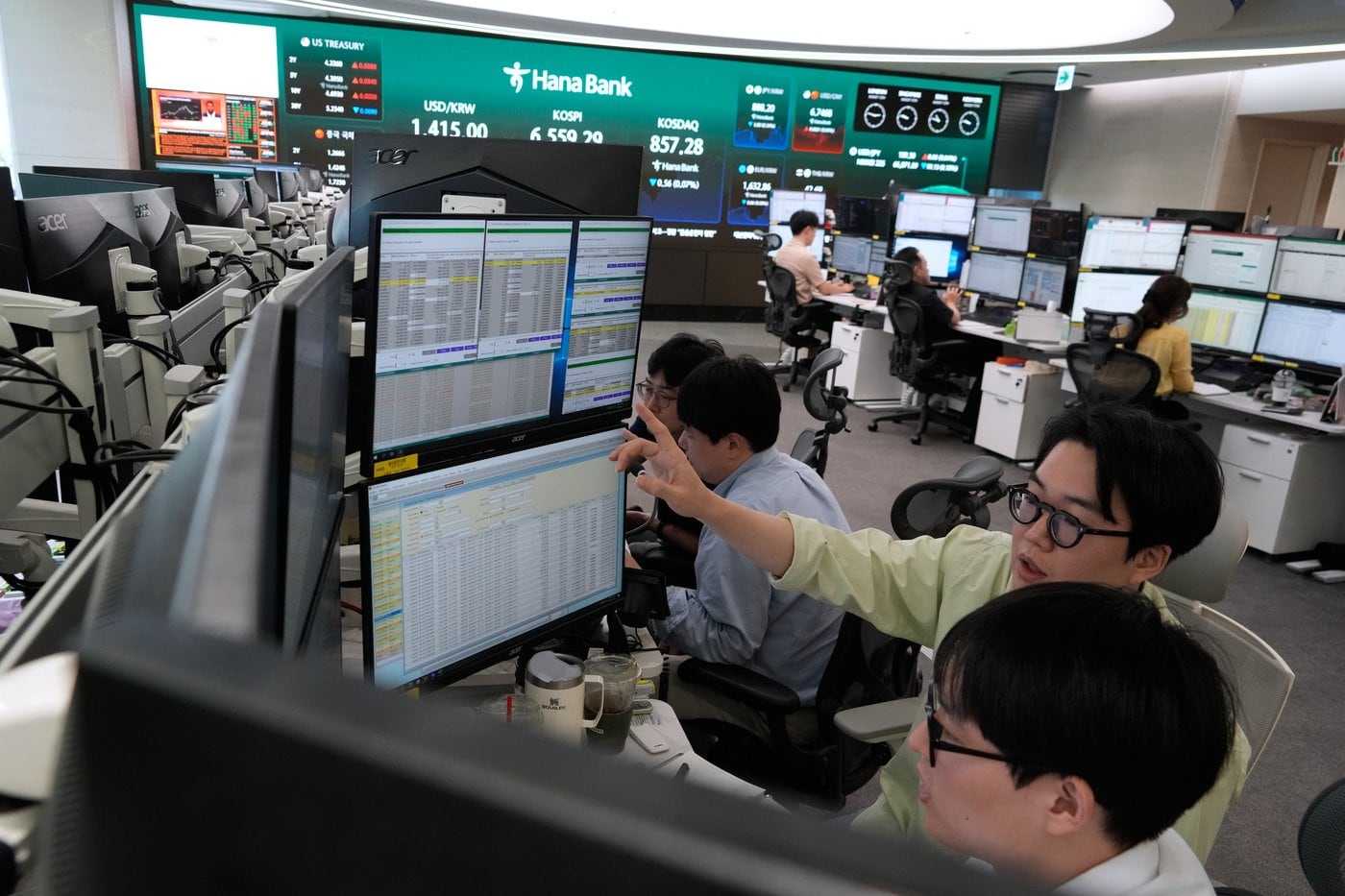Shares are mixed in Europe and Asia ahead of U.S. inflation report, while oil prices gain